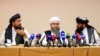 From left, Mohammad Naim, Mawlawi Shahabuddin Dilawar and Suhil Shaheen, members of a political delegation from the Afghan Taliban's movement, attend a news conference in Moscow, July 9, 2021.
