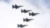 Тайванські винищувачі F-16 над Офісом президента під час святкування Національного дня перед будівлею президента в Тайбеї, Тайвань, 10 жовтня 2021 року. AP Photo/Chiang Ying-ying