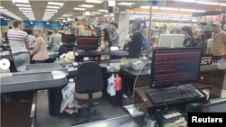 Customers queue in 'Rost' supermarket in Kharkiv, Ukraine, June 27, 2017 in this picture obtained from social media. 