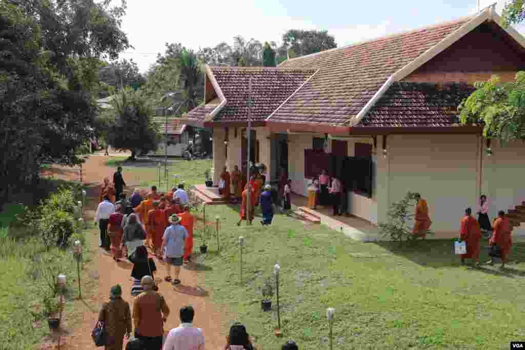 Guests walked through the museum&rsquo;s campus to the gallery hall featuring recovery efforts including demining and advocating for victims of war, in the procession after Buddhist monks. (Rithy Odom/VOA)