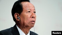 FILE - General Tea Banh, Cambodia's Defense Minister, waits for his turn to speak at 11th International Institute of Strategic Studies Asia Security Summit, in Singapore, June 2012.