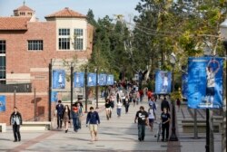 FILE - Students walk on the UCLA campus in Los Angeles, Feb. 26, 2015.