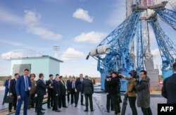 TOPSHOT - In this pool photo distributed by Sputnik agency, Russia's President Vladimir Putin (centre L) and North Korea's leader Kim Jong Un (centre R) visit the Vostochny Cosmodrome in Amur region on September 13, 2023.