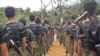 FILE - Arakan Army recruits scale the climbing ropes at the Laiza, Kachin state base camp.