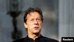 FILE - Pakistan's Prime Minister Imran Khan speaks during a joint news conference with Afghan President Ashraf Ghani (not pictured) at the presidential palace in Kabul, Afghanistan, Nov. 19, 2020.
