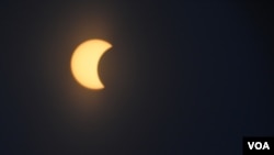 FILE - The moon is seen as it passes in front of the sun during a partial solar eclipse in Washington, D.C., Monday, Aug. 21, 2017. (Photo: Diaa Bekheet)