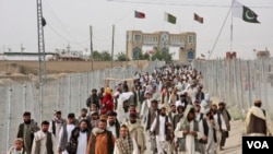 Pakistanis rally at the closed Chaman border crossing between Pakistan and Afghanistan. Islamabad is blaming Thursdays deadly terror attack in a remote town in Sindh province on a terror group it says operates out of Afghanistan.