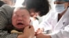 2018年7月26日，一名儿童在中国安徽东部省淮北市的一家医院接受了疫苗注射。
