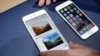 FILE - In this Tuesday, Sept. 9, 2014, file photo, the iPhone 6 plus, left, and iPhone 6 are displayed, in Cupertino, Calif. 