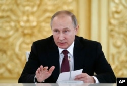 Russia's President Vladimir Putin delivers a speech during a session of the Council for Civil Society and Human Rights in Moscow, Dec. 8, 2016.
