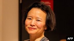 This handout photograph taken on Oct. 11, 2023 and released by Australia's Department of Foreign Affairs and Trade shows Australian journalist Cheng Lei upon her arrival at the airport in Melbourne.