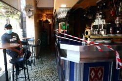 A bar counter is sealed off to prevent contact between customers at the Vallecas neighborhood, amid the coronavirus disease outbreak in Madrid, Spain, Sept. 25, 2020.
