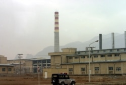 A security car passes in front of the Natanz nuclear facility located 300 kilometers (185 miles) south of Tehran, Nov. 20, 2004.