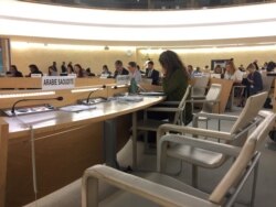 FILE - The empty seats for the delegation of Saudi Arabia are seen during a session of the Human Rights Council at the United Nations in Geneva, Switzerland, Sept. 23, 2019.