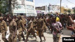 Ethiopian government soldiers and prisoners of war in military uniforms walk through the streets of Mekelle, the capital of Tigray region, Ethiopia, July 2, 2021. 