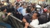 Opposition demonstrators were met with police blockage but eventually they relented and allowed the demonstrators to pass. (Photo: Hul Reaksmey/VOA Khmer)