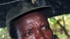 Le leader de la LRA, Joseph Kony, et son adjoint, Vincent Otti, sous une tente, en 2006, à Ri-Kwamba, au Sud-Soudan