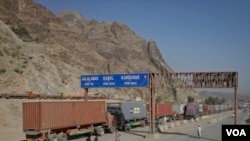 Trucks carrying freight containers stand idle at the closed Torkham border crossing between Pakistan and Afghanistan. The closure of border crossings has further raised tensions between the two neighbors, which already have a history of mistrust toward one another.