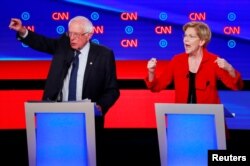 សមាជិក​ព្រឹទ្ធសភា លោក Bernie Sanders និង​លោក​ស្រី ​Elizabeth Warren ​ថ្លែង​ក្នុង​ការ​ជជែក​ដេញ​ដោល​យប់​ទី​១ នៃ​វគ្គ​ទី​២ ក្នុង​ការ​ដេញ​ដោល​ដើម្បី​បាន​បេក្ខភាព​របស់​គណបក្ស​ប្រជាធិបតេយ្យ នៅ​ទីក្រុង Detroit រដ្ឋ Michigan សហរដ្ឋ​អាមេរិក។