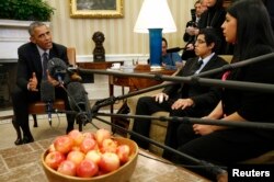 FILE - President Barack Obama meets with a group of "dreamers" who have received Deferred Action for Childhood Arrivals (DACA) at the White House in Washington, Feb. 4, 2015.