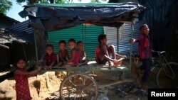Rohingya refugee children play in Kutupalong refugee camp near Cox's Bazar, Bangladesh, Nov. 6, 2017.
