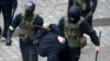 Police detain a man during an opposition rally to protest the official presidential election results in Minsk, Belarus, Nov. 8, 2020.