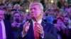 FILE - U.S. President-elect Donald Trump arrives to attend a rally the day before he is scheduled to be inaugurated for a second term, in Washington, Jan. 19, 2025. 