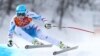 Austria's Matthias Mayer makes a turn in the men's downhill at the Sochi 2014 Winter Olympics, Sunday, Feb. 9, 2014, in Krasnaya Polyana, Russia.