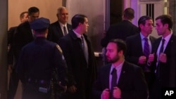 Vice President-elect Mike Pence, top center, leaves the Richard Rodgers Theatre after a performance of "Hamilton," in New York, Friday, Nov. 18, 2016. 
