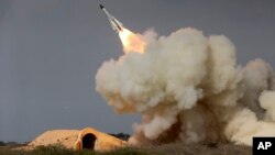 FILE - A long-range S-200 missile is fired in a military drill in the port city of Bushehr, on the northern coast of Persian Gulf, Iran, Dec. 29, 2016. 
