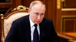 In this Jan. 18, 2022, photo, Russian President Vladimir Putin listens during a meeting in the Kremlin, in Moscow, Russia.