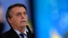 Presiden Brazil Jair Bolsonaro berbicara dalam sebuah acara di Istana Kepresidenan Planalto di Brasilia, Brazil, pada 25 Maret 2021. (Foto: AP/Eraldo Peres)