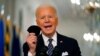 Presiden AS Joe Biden menggenggam maskernya saat berbicara mengenai pandemo COVID-19 dari East Room di Gedung Putih, Kamis, 11 Maret 2021.