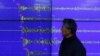 Yun Won-tae of the Korea Meteorological Administration stands in front of a screen showing seismic waves that were measured in Seoul after North Korea said it had conducted a powerful hydrogen bomb test, Dec. 6, 2015.