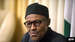 FILE - Nigerian president Muhammadu Buhari gives an interview to Agence France-presse at his hotel during the 25th African Summit, June 14, 2015 in Johannesburg. 