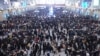 Travelers wait for trains at Hangzhou East railway station during the Spring Festival travel rush ahead of the Chinese Lunar New Year, in Hangzhou, Zhejiang province, China, Jan. 20, 2023.