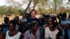 FILE - U.S. development worker John Granville, center, is pictured in this undated photo from the U.S. Agency for International Development, released Aug. 8, 2008. Granville and a colleague were shot to death in Sudan in 2008.