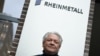 Armin Papperger, CEO of German defense and automotive group Rheinmetall AG poses in front of the company's logo following a Reuters interview in Duesseldorf, Germany, Jan. 27, 2023.