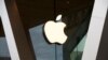 FILE - The Apple logo adorns an Apple store in New York City, March 14, 2020. The U.S. Justice Department has in recent months escalated its antitrust probe on Apple, according to a report in The Wall Street Journal.