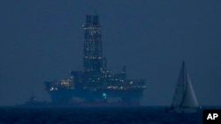 FILE - An offshore drilling rig is seen in the waters off Cyprus' coastal city of Limassol, July 5, 2020.