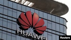FILE PHOTO: The Huawei logo is pictured outside its Huawei's factory campus in Dongguan, Guangdong province, China, March 25, 2019.