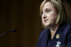 FILE - Julie Fisher, U.S. ambassador-designate to Belarus, testifies before a Senate Foreign Relations Committee hearing on Capitol Hill in Washington, June 9, 2021.
