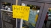 FILE - A sign at a fitness studio advertises a deal for furloughed government workers in the Capitol Hill neighborhood in Washington, Oct. 5, 2013. A government shutdown can hurt local businesses, said Ellen Zentner of the American Bankers Association.