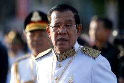 FILE - Cambodia's Prime Minister Hun Sen arrives at the Independence Monument to attend celebrations marking the 65th anniversary of the country's independence from France, in Phnom Penh, Cambodia, Nov. 9, 2018.