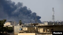 Smoke rises from from the old city during a battle against Islamic State militants, in Mosul, Iraq March, March 24, 2017.