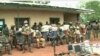 FILE - Cameroon's military displays weapons and other equipment it says were seized from separatists, in Bamenda, Cameroon, March 4, 2021. 