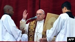 Pope Francis gives his traditional Christmas "Urbi et Orbi" blessing from the balcony of St. Peter's Basilica at the Vatican, Dec. 25, 2014.