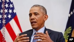 President Barack Obama, right, answers questions during his interview with Vox's Ezra Klein and Sarah Kliff, at the Blair House, across the street from the White House in Washington, Friday, Jan. 6, 2017 in Washington. 