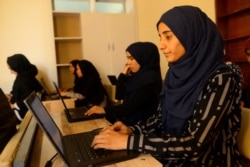 In this photo taken on Sept. 4, 2019 Afghan students attend a class at the Code to Inspire school in Herat.