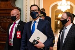 FILE - Treasury Secretary Steven Mnuchin makes a brief comment as he leaves the Capitol, Sept. 30, 2020.